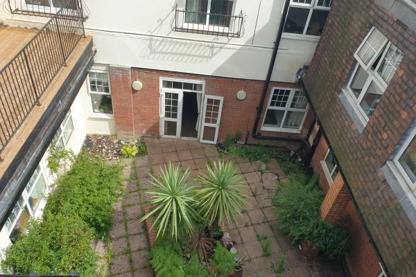 Garden pathway and conservatory at Parkview Nursing Home, Upper Norwood